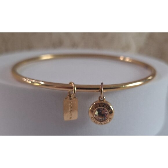 Coach Gold-tone Bangle Bracelet w/ Two Charm-Logo tag charm and Crystal Charm - Picture 1 of 8